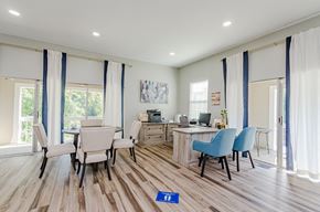 East Ridge apartment for rent - a common area with a desk and chairs and a table with a computer on it at Summit East Ridge, East Ridge, TN 