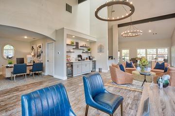 Arlington apartment for rent - A living room with blue chairs and a wooden floor.