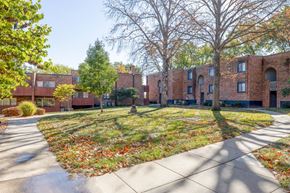 Kansas City apartment for rent - A brick building with a tree in front of it.