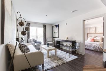 Atlanta apartment for rent - a living room with a couch and a chair and a television