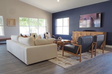 Frisco apartment for rent - A living room with a white couch and a wooden coffee table.