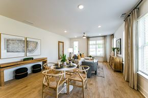 Hoschton apartment for rent - A dining room with a wooden table and chairs.