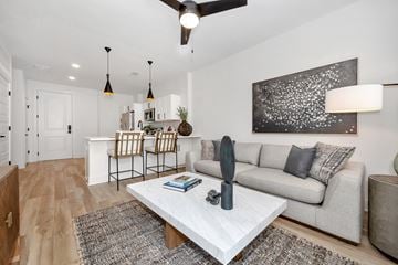 Huntsville apartment for rent - A modern living room with a white coffee table and a grey couch.