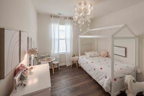 Kingsport townhouse for rent - a bedroom with a bed and a desk and a chandelier