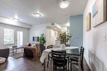 Denver apartment for rent - A dining room with a table set for four.