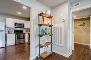 Atlanta apartment for rent - A kitchen with a white fridge and stove top oven.