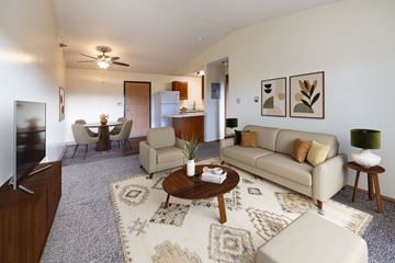 Altoona apartment for rent - A living room with a rug and a couch.