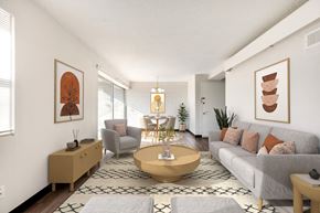 Prairie Village apartment for rent - A living room with a grey couch, a coffee table, and a rug.