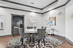 Columbus apartment for rent - A dining room with a white table and grey chairs.