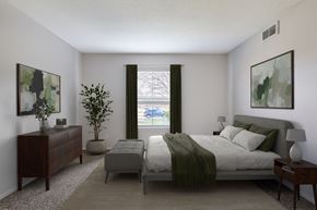 Prairie Village apartment for rent - A bedroom with a bed, nightstand, and a plant.