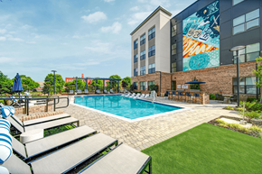 Rock Hill apartment for rent - a swimming pool with a building in the background