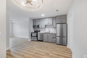 Moncks Corner apartment for rent - A kitchen with a refrigerator, oven, and microwave.