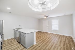 Moncks Corner apartment for rent - A kitchen with a white countertop and wooden flooring.