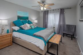 Nashville apartment for rent - a bedroom with a bed and a ceiling fan