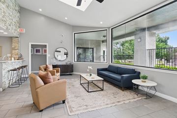 Arlington apartment for rent - A living room with a blue couch and a fireplace.