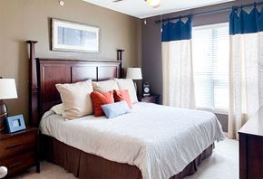 Beaumont apartment for rent - a bedroom with a large bed and two windows