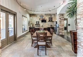 Beaumont apartment for rent - a dining room with a wooden table and chairs