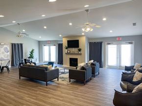 Indianapolis apartment for rent - a living room with couches and chairs and a fireplace