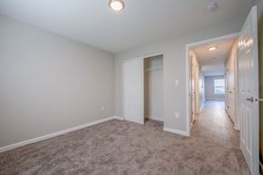 Indianapolis apartment for rent - a room with a carpeted floor and a hallway with a closet