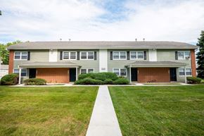 Columbus apartment for rent - a house with a lawn and a sidewalk in front of it