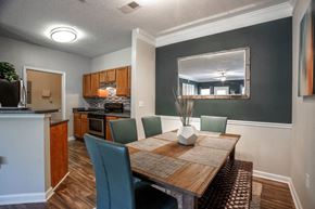College Park apartment for rent - a dining room table with a kitchen in the background