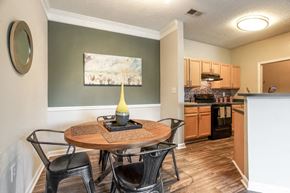College Park apartment for rent - a dining room and kitchen with a table and chairs