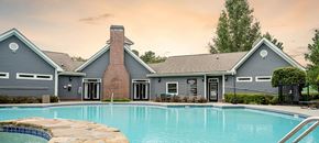 College Park apartment for rent - a large swimming pool in front of a house
