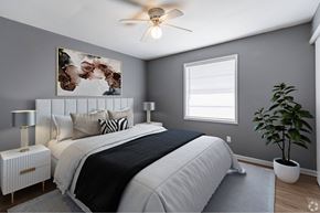 Atlanta apartment for rent - an image of a bedroom with a bed and a ceiling fan