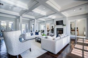Birmingham apartment for rent - a large living room with white furniture and a fireplace at Century Lakeshore Crossings, Alabama, 35211