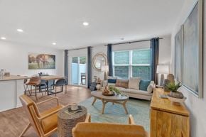 Gray apartment for rent - A living room with a sofa, chairs, and a coffee table.