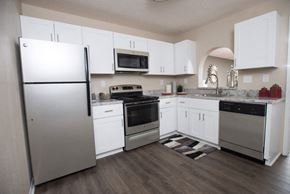 Hoover apartment for rent - A kitchen with white cabinets and a refrigerator at Ridge Crossings Apartments, Hoover, 35244