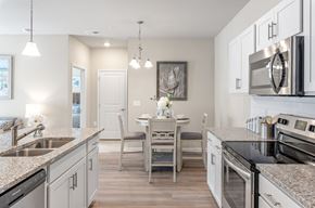 Summerville apartment for rent - A modern kitchen with a dining table and chairs.