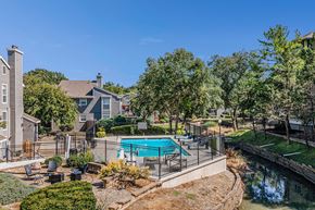 Prairie Village apartment for rent - A backyard with a pool and a fence.