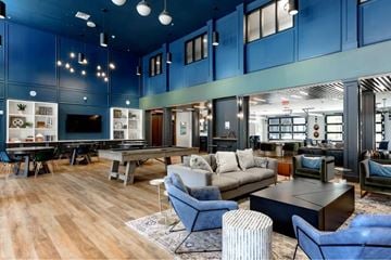 Columbus apartment for rent - A modern living room with a pool table and a TV.