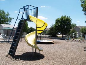 Altoona apartment for rent - A playground with a yellow slide and a ladder.