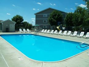 Altoona apartment for rent - A swimming pool with chairs around it.