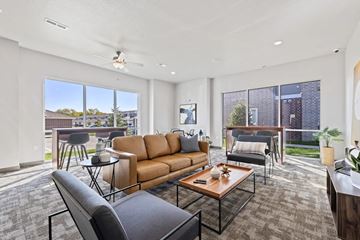 Altoona apartment for rent - A living room with a brown sofa and a coffee table.