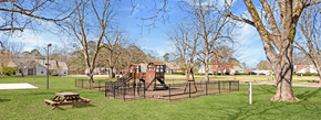Newnan apartment for rent - A playground with a slide and a picnic table.
