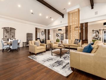 Columbus apartment for rent - A living room with a large beige sofa and a wooden coffee table.
