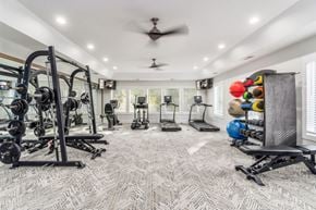 Gahanna apartment for rent - A spacious home gym with a variety of exercise equipment.