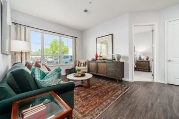Lewis Center apartment for rent - A living room with a green couch and a wooden coffee table.
