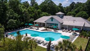 Savannah apartment for rent - A large house with a pool in the backyard.