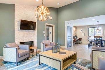 Smyrna apartment for rent - A living room with a fireplace and a television mounted above it.