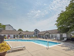 Lexington apartment for rent - our apartments offer a swimming pool with our buildings in the background