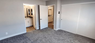 Chula Vista apartment for rent - a living room with a carpet and a door to a bathroom