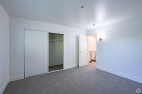 Santa Rosa apartment for rent - a bedroom with white walls and a closet with mirrored doors