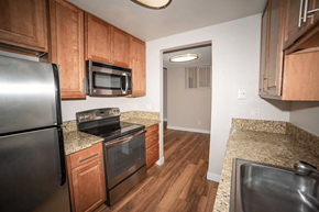 San Diego apartment for rent - a kitchen with stainless steel appliances and granite counter tops