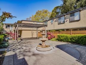 Santa Rosa apartment for rent - a fountain in the middle of a driveway in front of a house