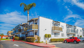 Chula Vista apartment for rent - a car parked in front of an apartment building with a palm tree