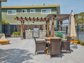 Rohnert Park apartment for rent - a patio with a table and chairs and a grill